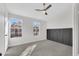 Well-lit bedroom with dark accent wall and carpeted floor at 18621 N 34Th Ave # 1, Phoenix, AZ 85027