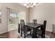 Dining area with a dark wood table and four chairs at 18727 N Desert Light Dr, Surprise, AZ 85387