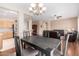 Open concept dining area with a view of the kitchen and living room at 18727 N Desert Light Dr, Surprise, AZ 85387