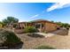 One-story home with covered patio and desert landscaping at 18727 N Desert Light Dr, Surprise, AZ 85387