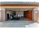 Garage with storage cabinets and extra space for parking at 18727 N Desert Light Dr, Surprise, AZ 85387