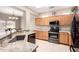 Bright kitchen boasts granite countertops and stainless steel appliances at 18727 N Desert Light Dr, Surprise, AZ 85387