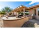 Covered patio with seating area, perfect for outdoor entertaining at 18727 N Desert Light Dr, Surprise, AZ 85387