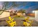 Serene backyard with yellow chairs and string lights at 1921 W Monte Vista Rd, Phoenix, AZ 85009