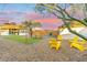 Relaxing backyard with yellow chairs and a picnic table at 1921 W Monte Vista Rd, Phoenix, AZ 85009