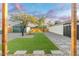 Landscaped backyard with artificial turf and stone pathway at 1921 W Monte Vista Rd, Phoenix, AZ 85009