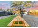 Backyard with picnic table, games, and a tree at 1921 W Monte Vista Rd, Phoenix, AZ 85009