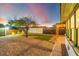 Landscaped backyard with pergola, string lights, and seating at 1921 W Monte Vista Rd, Phoenix, AZ 85009