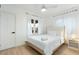 Bedroom with queen bed, light wood frame, and ceiling fan at 1921 W Monte Vista Rd, Phoenix, AZ 85009