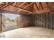 Unfinished garage with open doors to backyard at 1921 W Monte Vista Rd, Phoenix, AZ 85009