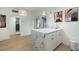 Modern kitchen with a white quartz island and a view of the back patio at 1921 W Monte Vista Rd, Phoenix, AZ 85009