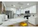 Updated kitchen featuring white cabinets and marble countertops at 1921 W Monte Vista Rd, Phoenix, AZ 85009