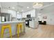 Modern kitchen with white cabinets, marble counters, and island at 1921 W Monte Vista Rd, Phoenix, AZ 85009