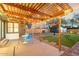 Peaceful patio with pergola, string lights, and blue chairs at 1921 W Monte Vista Rd, Phoenix, AZ 85009