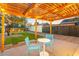 Cozy patio with pergola, string lights, and blue chairs at 1921 W Monte Vista Rd, Phoenix, AZ 85009