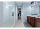 Bright bathroom showcasing a walk-in shower with white subway tile and a spacious walk-in closet at 1983 E Sarona Ct, San Tan Valley, AZ 85143