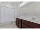 Clean bathroom features a single sink vanity, a toilet, and a shower/tub with a white shower curtain at 1983 E Sarona Ct, San Tan Valley, AZ 85143