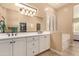 Bright bathroom featuring double sinks and a separate tub and shower at 2049 N 88Th St, Mesa, AZ 85207