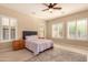 Comfortable bedroom with wood furniture and large windows at 2049 N 88Th St, Mesa, AZ 85207