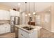 Open kitchen with white cabinets and granite countertops at 2049 N 88Th St, Mesa, AZ 85207