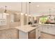 Modern kitchen with island, double sink, and granite countertops at 2049 N 88Th St, Mesa, AZ 85207