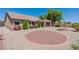 Spacious backyard with fire pit, gravel landscaping, and covered patio at 20767 N Bustos Way, Maricopa, AZ 85138