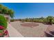 Landscaped backyard with gravel and firepit at 20767 N Bustos Way, Maricopa, AZ 85138