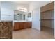 Main bathroom with double vanity and access to closet at 20767 N Bustos Way, Maricopa, AZ 85138