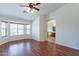 Spacious bedroom with wood floors and large window at 20767 N Bustos Way, Maricopa, AZ 85138