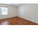 Bright bedroom featuring wood floors and a window at 20767 N Bustos Way, Maricopa, AZ 85138