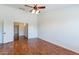 Bright bedroom with hardwood floors and double doors at 20767 N Bustos Way, Maricopa, AZ 85138