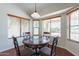 Bright breakfast nook features a round table and chairs, perfect for morning meals at 20767 N Bustos Way, Maricopa, AZ 85138