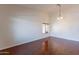 Hardwood floors and recessed lighting enhance this formal dining room at 20767 N Bustos Way, Maricopa, AZ 85138