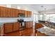 Spacious kitchen with granite countertops and stainless steel appliances at 20767 N Bustos Way, Maricopa, AZ 85138