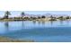 Lake with mountain views and lush landscaping at 20767 N Bustos Way, Maricopa, AZ 85138