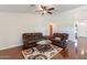 Living room with brown leather couches and a coffee table at 20767 N Bustos Way, Maricopa, AZ 85138