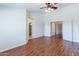 Main bedroom features hardwood floors and access to other rooms at 20767 N Bustos Way, Maricopa, AZ 85138