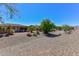 Expansive backyard showcasing desert landscaping and a view at 20876 N Canyon Whisper Dr, Surprise, AZ 85387