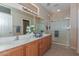 Double vanity bathroom with large shower at 20876 N Canyon Whisper Dr, Surprise, AZ 85387