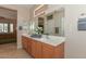 Double vanity bathroom with a view into bedroom at 20876 N Canyon Whisper Dr, Surprise, AZ 85387