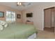 Bedroom with king-size bed and TV at 20876 N Canyon Whisper Dr, Surprise, AZ 85387