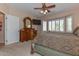 Primary bedroom with dresser and large window at 20876 N Canyon Whisper Dr, Surprise, AZ 85387