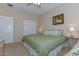 Bedroom with king-size bed and double doors at 20876 N Canyon Whisper Dr, Surprise, AZ 85387