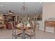 Open dining area with table and chairs near kitchen at 20876 N Canyon Whisper Dr, Surprise, AZ 85387