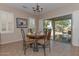 Bright dining area with table, chairs, and view of backyard at 20876 N Canyon Whisper Dr, Surprise, AZ 85387