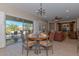 Dining area with table and chairs, open to living room at 20876 N Canyon Whisper Dr, Surprise, AZ 85387