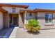 Front entry with walkway and mature desert landscaping at 20876 N Canyon Whisper Dr, Surprise, AZ 85387