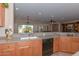 Kitchen with double sink, dishwasher, and ample counter space at 20876 N Canyon Whisper Dr, Surprise, AZ 85387