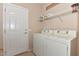 Laundry room with washer, dryer, and shelving at 20876 N Canyon Whisper Dr, Surprise, AZ 85387