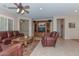 Living room with leather furniture and entertainment center at 20876 N Canyon Whisper Dr, Surprise, AZ 85387